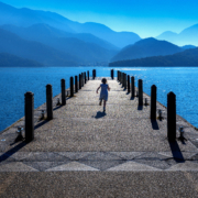 Little girl running on pathway in Sun moon lake, Taiwan.